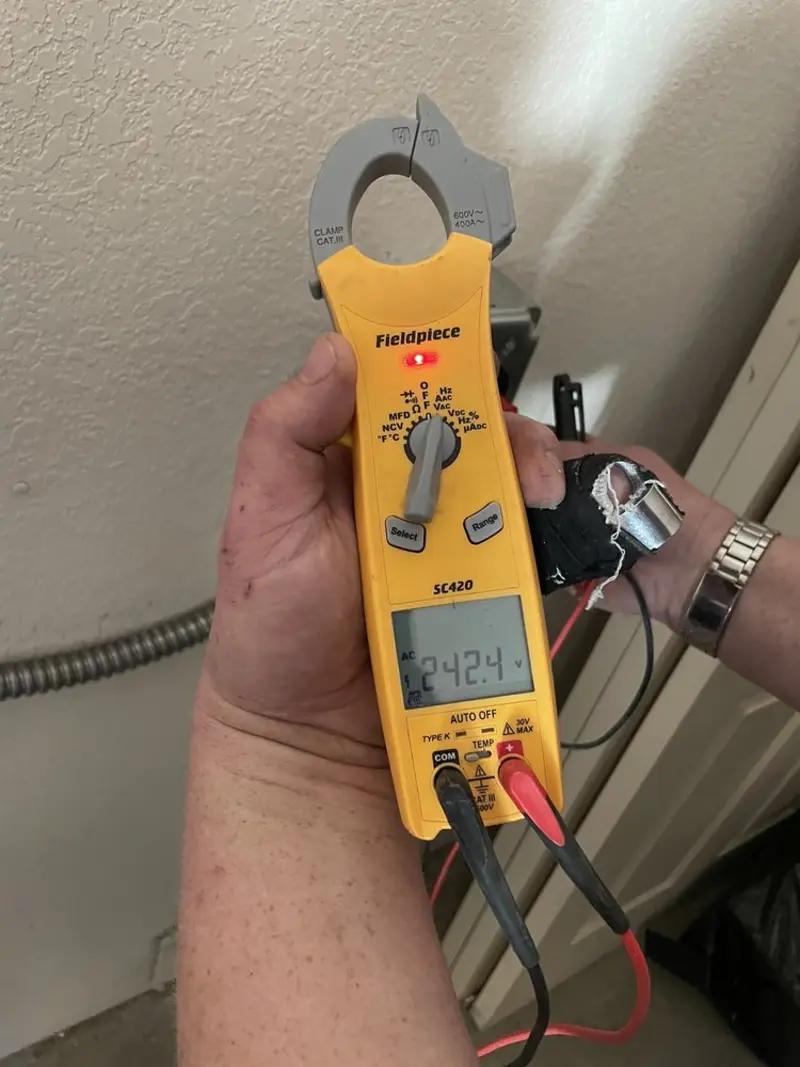 Voltage testing with clamp meter during Ceiling Fan Installation in Lock Haven